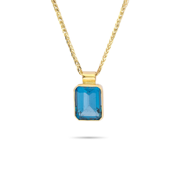 14K Gold pendant with Blue Topaz. Spiga 14K chain 20 inch.